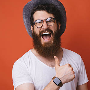 A man gives a thumbs up after receiving dental services at Lovett Dental Vintage Park