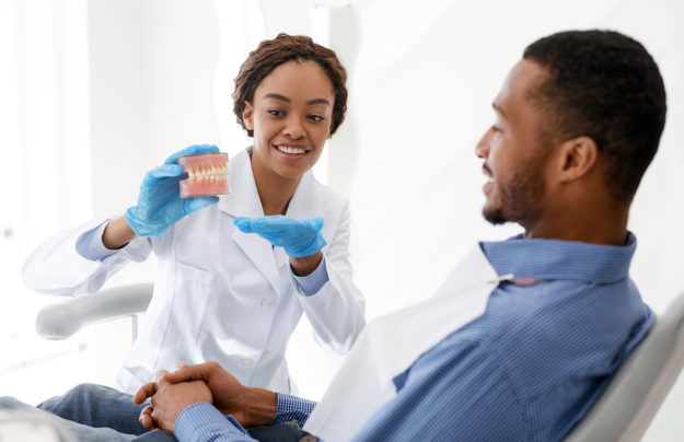dental health services (1) man using Dental Health Services for dentures