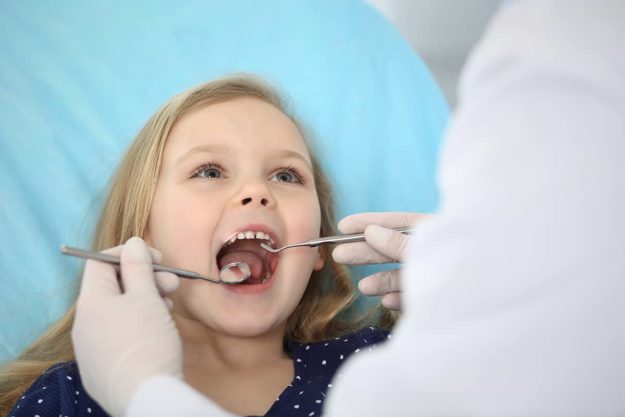 oral health Little girl wonders which candies are safe for Halloween