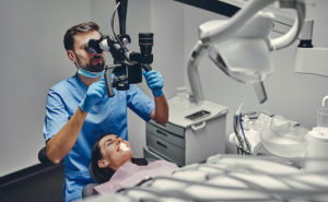 Dr. prepares a patient for a root canal