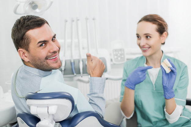 3 Benefits of Adult Orthodontic Services (2) patient learning about adult orthodontics